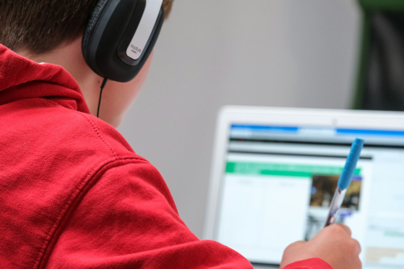 A boy in an online lesson on his laptop